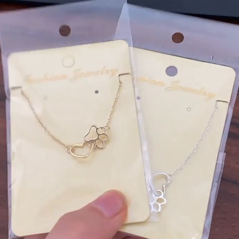 New product dog paw footprint peach heart necklace ins women's hollow love-shaped clavicle chain European and American popular manufacturers now wholesale