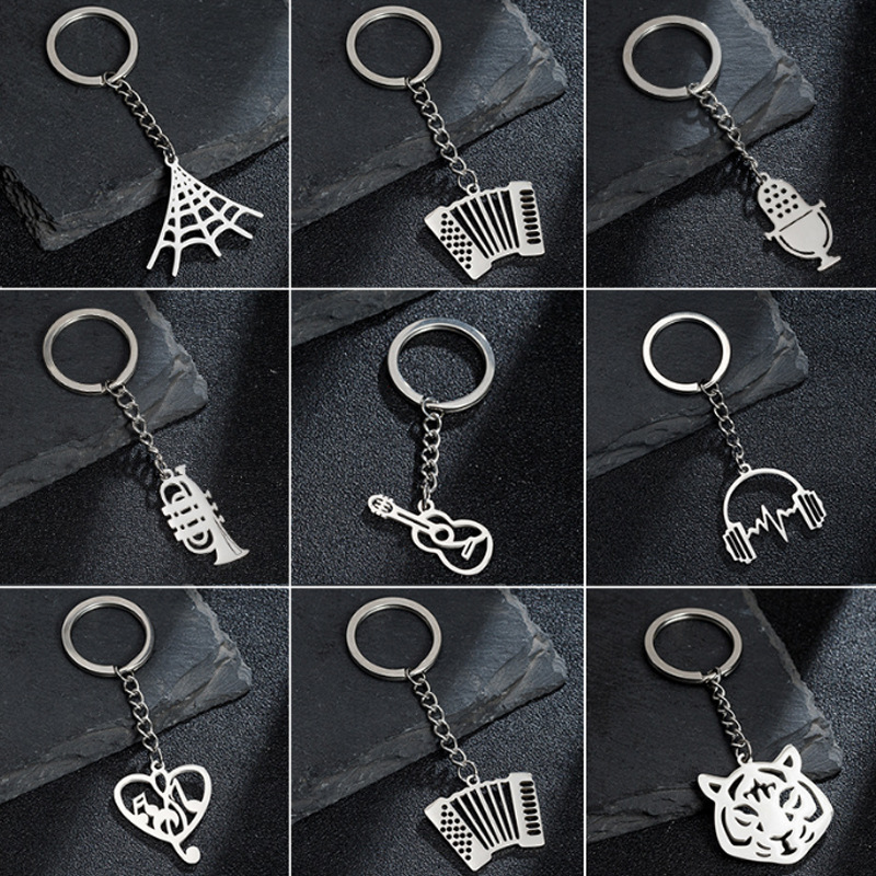 Simple foreign trade new accessories stainless steel musical instruments Halloween spider web creative keychain pendant pendant couple