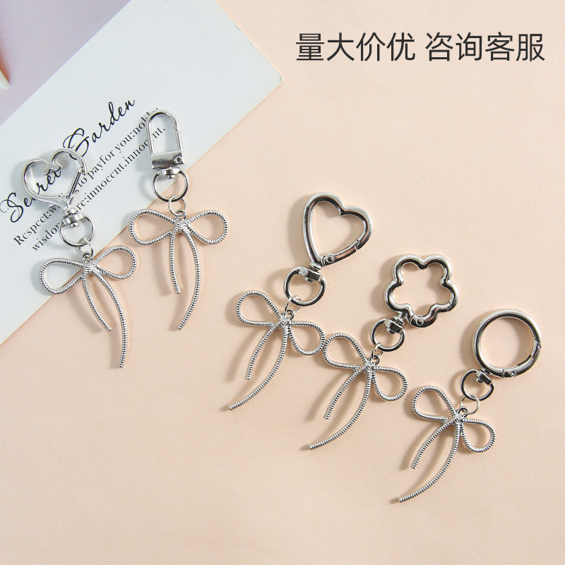 New idea zinc alloy sweet and cool hollow bow key pendant pendant necklace bracelet earrings accessories materials wholesale
