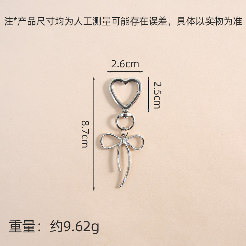 New idea zinc alloy sweet and cool hollow bow key pendant pendant necklace bracelet earrings accessories materials wholesale