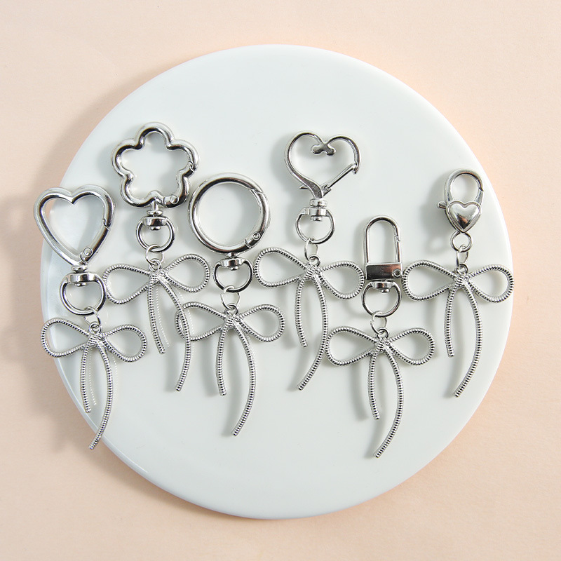 New idea zinc alloy sweet and cool hollow bow key pendant pendant necklace bracelet earrings accessories materials wholesale