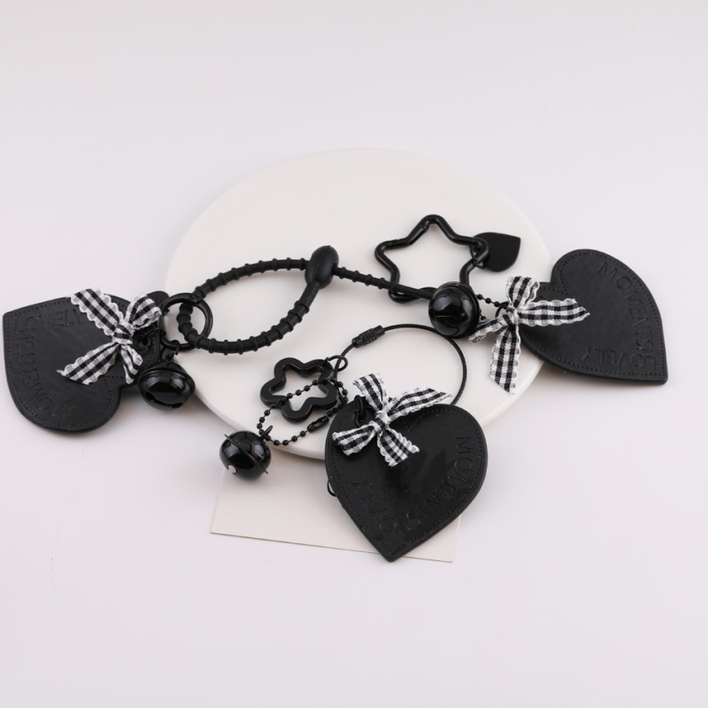 Creative new black leather love hollow star bow keychain bag pendant jewelry accessories