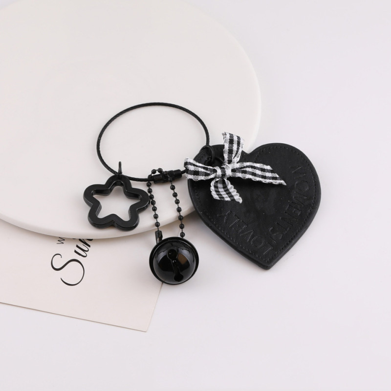 Creative new black leather love hollow star bow keychain bag pendant jewelry accessories